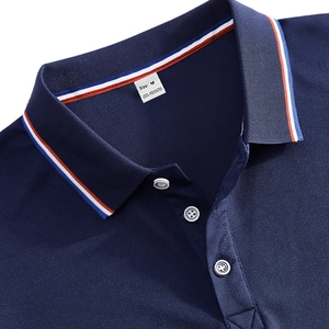 Detail of navy blue polo shirt collar with red-white-blue stripes and pique mesh texture