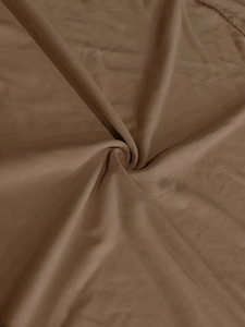 Close-up of brown breathable knit fabric texture with soft drape for men sports set