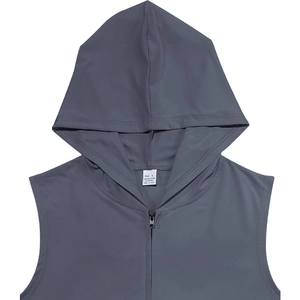 Close-up of the wash label on dark gray hooded vest showing fabric and size details