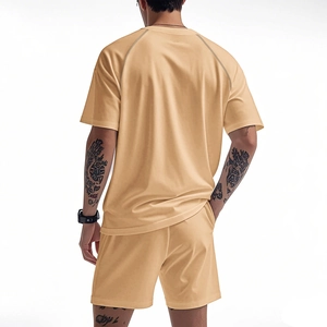 Rear view of men's beige quick-dry sports set showing raglan sleeve detail and fit