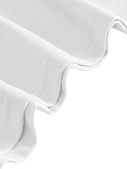 Detail of white polo shirt featuring a wavy hem design and reinforced double stitching