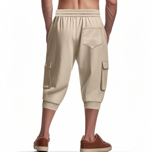 Back view of men's beige cargo shorts with elastic waist and large flap pockets