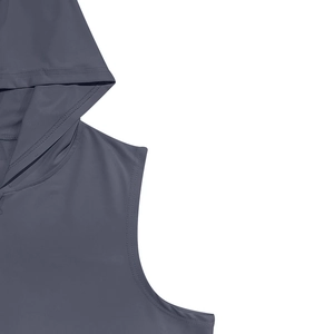 Detail of the hooded sleeveless vest showing fine stitching and grey-blue textured fabric