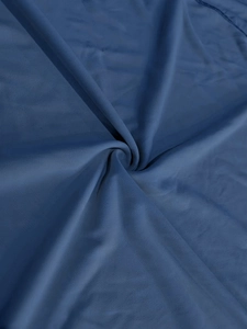 Detail of dark blue breathable sports fabric with fine texture and smooth drape