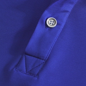 Macro shot of Royal Blue Polo shirt detail featuring breathable pique mesh and white button