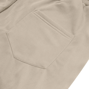 Detail of double-stitched back pocket on heavy cotton twill cargo shorts in khaki