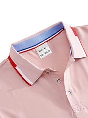 Detail of pink Polo shirt collar with red and white stripes and 100% polyester label