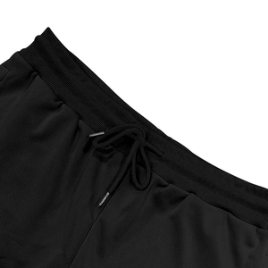 Detail of men's cargo shorts showing elastic waistband with metal tipped drawstring