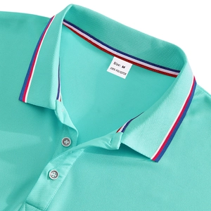 Detail of mint green polo shirt collar with tri-color stripes and pique fabric texture
