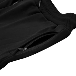 Detail of men's black cargo shorts showing elastic waist with drawstring and zipper pocket