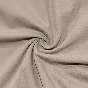 Macro shot of beige short-sleeve polo shirt fabric with soft twill texture detail