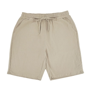 Detailed view of khaki linen shorts with elastic drawstring waist and side pockets