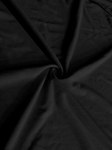 Detailed view of lightweight black textile fabric with smooth silk-like texture and sheen