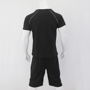 Back view of men's black sports set with raglan sleeves and grey contrast stitching details
