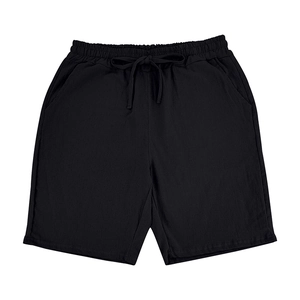 Detail of black linen casual shorts with elastic drawstring waist and fabric texture