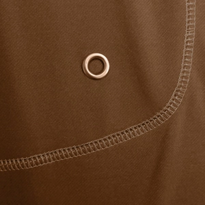 Close-up of bronze eyelet and reinforced stitching on dark brown breathable sportswear