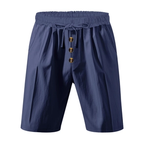 Detail of navy blue linen shorts with elastic drawstring waist and amber buttons