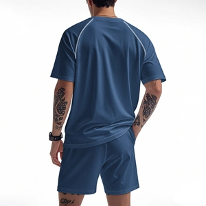 Rear view of men's quick-dry navy sports set showing raglan sleeves and contrast stitching