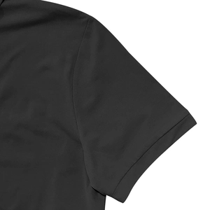 Close-up of precise stitching and premium fabric texture on black men's polo shirt