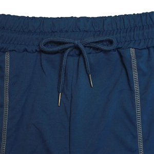 Detail view of navy sports shorts waist with elastic band and metal-tipped drawstring