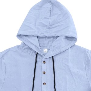 Detail of light blue linen-style hoodie with drawstring and wood grain buttons