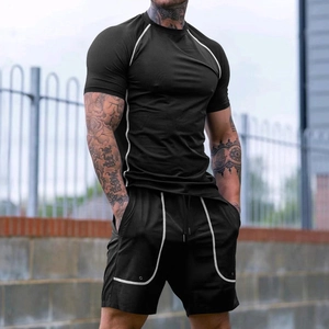 Ensemble de sport noir pour homme avec coutures contrastées blanches et tissu respirant