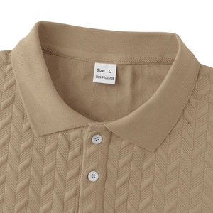 Detail of khaki polo shirt neckline featuring herringbone texture and white buttons