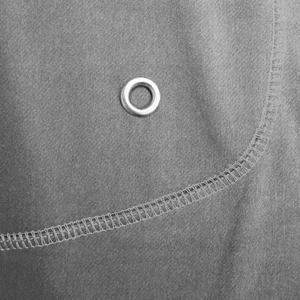 Detailed close-up of grey knit fabric showing metal eyelet and flatlock stitching