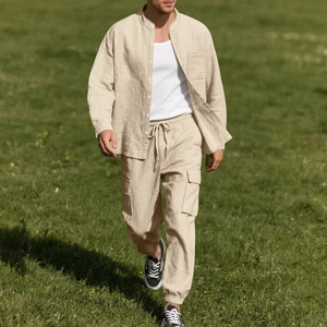 Detail of men's linen-style cargo pants with flap pockets and drawstring elastic waist