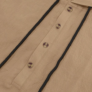 Detail of khaki linen shirt fabric with textured weave and marbled button closure