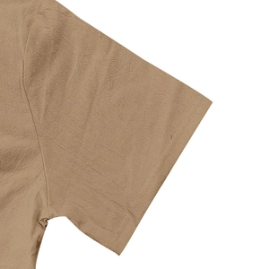Close-up of the breathable khaki linen fabric texture and double-stitched sleeve cuff detail