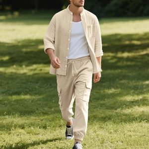 Detail view of khaki linen shirt collar and drawstring pants with cargo pockets