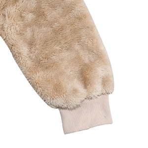 Close-up of the plush fleece sleeve cuff with elastic ribbed windproof design