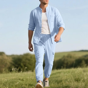 Detail of light blue linen shirt with mandarin collar and drawstring cargo pants