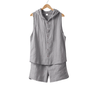 Detail view of breathable linen fabric texture on men's sleeveless hooded shirt and shorts