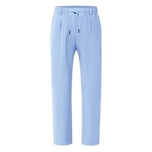 Detail of light blue linen pants featuring elastic drawstring waist and straight pleated leg