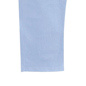 Close-up of light blue linen fabric texture and premium double stitching on hem