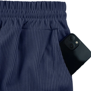 Detail view of corduroy shorts with elastic waist and deep side pocket for smartphone