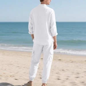 Rear view of white linen shirt and cargo joggers set on a beach with natural lighting