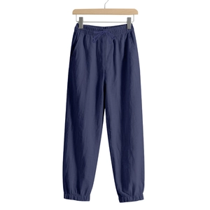Detailed view of navy blue linen jogger pants featuring elastic waistband and drawstring