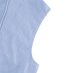 Detailed close-up of light blue linen fabric texture and stitching on sleeveless hoodie