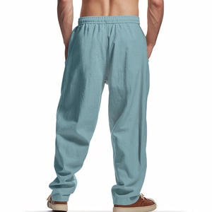Rear view of light blue linen trousers for men with elastic waist and relaxed fit