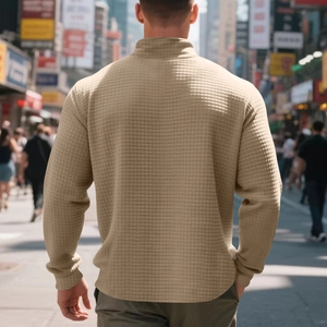 Detail view of khaki waffle texture fabric and stand collar on men's casual sweatshirt