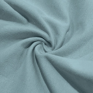 Detailed macro shot of morandi blue linen fabric texture and soft material folding