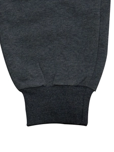 Detail of dark grey tracksuit with elastic ribbed cuffs and premium cotton stitching