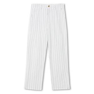 Detail of white linen trousers featuring black vertical stripes and a classic button waist