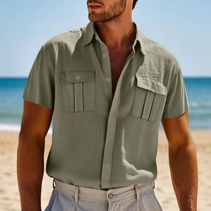 Close-up of olive green linen shirt featuring buttoned utility pockets and natural texture