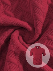 Macro shot of breathable herringbone texture and classic collar on burgundy polo shirt