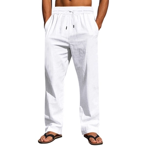 Close-up of men's white linen pants featuring elastic drawstring waist and textured fabric