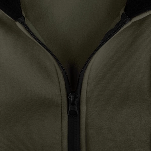 Detail of army green fleece lining and black zipper on warm hooded tracksuit jacket